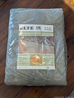 Front view of sealed ELTE Super Stop rug pad