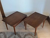 Two wooden rectangular end tables top view