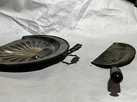 Large and small embossed metal dust pans