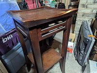 Full view of wooden side table showing top and structure