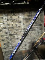 Full view of Atom NorCross skis leaning against wall