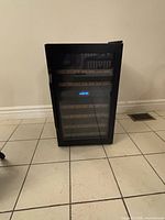 Front view of closed cooler showing glass door and size