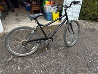 Black Raleigh bicycle left side view