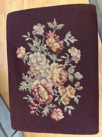 Top view showing needlepoint floral upholstery