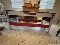 Rear view of Rec-Tek combination table showing frame and supports