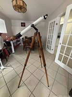 Full view of telescope on wooden tripod