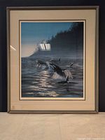 Frontal view of framed orca print showing artwork, mat, and frame
