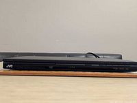 Front view of JVC XV-N350 DVD player, showing slim black chassis and branding