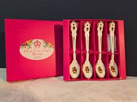 Four floral porcelain teaspoons in branded pink box