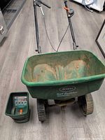 Full view of push spreader and handheld hopper