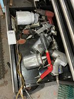 Drawer view of assorted air tools including spray guns, impact wrench, die grinders, blow wand and hose