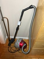 Overall view of Samsung canister vacuum showing body, hose, wand and floor head