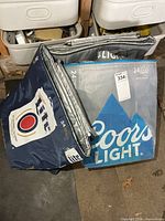 Front view of two beer-branded insulated cooler bags