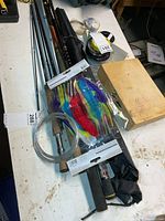 Overview showing rod sections, Johncoo rod bag, line spools, lures and leaders