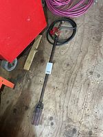 Full view of torch wand with hose coiled