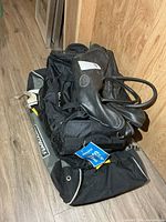 Stacked bags showing Winnwell hockey bag and others