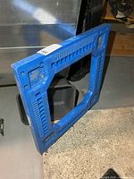Front angled view of blue 24" resin dolly showing overall structure