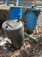 Overview of three barrels showing colors, sizes and hose connection