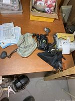 Group of reels on table showing multiple units and storage pouches