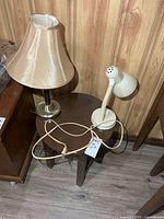 Stool with table lamp and desk lamp on wood floor