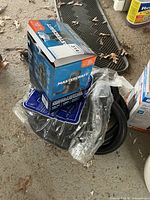 Boxed Mastercraft sump pump with hose on floor