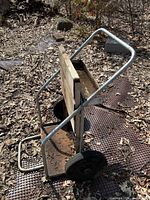 side view of steel welding cart showing frame, wheels, platform