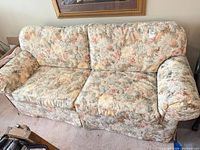 Front view of three-seat floral sofa