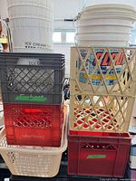 Stacked milk crates, plastic buckets