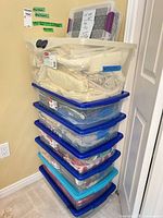 stack of eight fabric-filled storage tubs