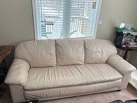 Full front view of beige/cream leather 3-seater sofa