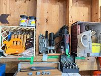 Shelf view showing router, BIS-KIT attachment, chisels, router bits, sanding supplies