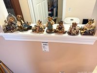All seven Boyds Bearstones figurines displayed on ledge