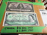 Both banknotes laid flat showing obverse designs