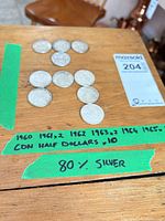 All ten coins laid out with tape label noting years and quantity