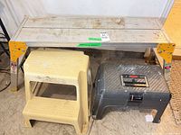 Work platform, beige step stool, black storage stool overview