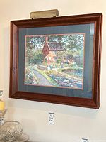 Front view of framed print with picture light