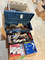 Toolbox overall view showing boxed wire, connectors, outlets, tools