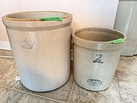 Front view of both crocks showing size difference and exterior glazing