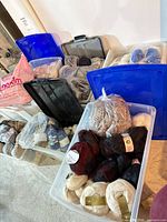 Multiple bins filled with assorted yarn skeins