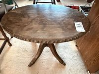 Full view of round side table showing top surface and base