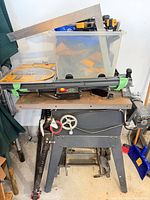 Full view of Craftsman table saw on stand with accessories and packaged blade