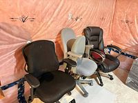 Overall view of three office chairs lined up