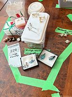 Overview of lot with multiple boxed earring pairs and Vendome set