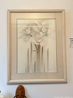 Framed floral print on wall, full view