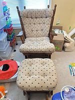 Front view of chair and ottoman showing overall design and upholstery