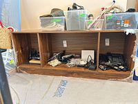 Front view of veneer cabinet showing three open cubbies