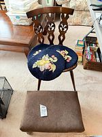 Overall lot showing chair with cushions and footstool