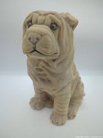 Front three-quarter view of flocked Shar Pei figurine showing overall form and color