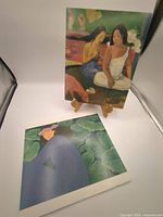 Both prints displayed, Gauguin print on easel, Hopper print flat