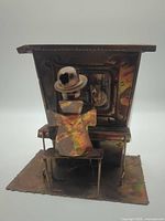 Rear view of metal piano player music box